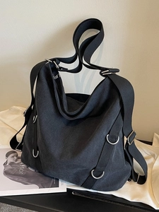 Schwarze große Canvas-Tragetasche mit Metallringen und verstellbarem Riemen für den Alltag