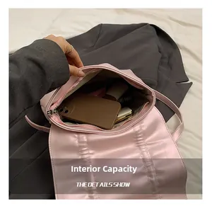 Pink pleated backpack interior showing capacity for phone, wallet and cosmetics