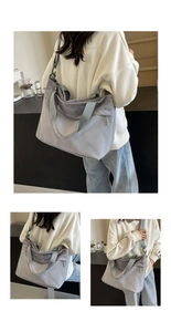 Detail view of large grey oxford fabric tote bag showing mesh texture and shoulder strap
