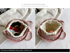 Detailed view of pink hollow bucket bag with inner canvas drawstring pouch and storage space