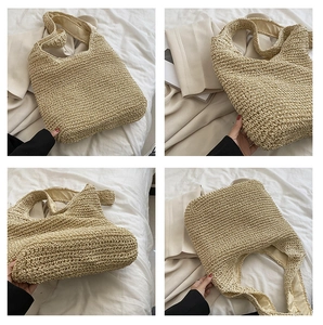 Macro details of hand-woven straw tote bag with reinforced stitching and textured weave pattern