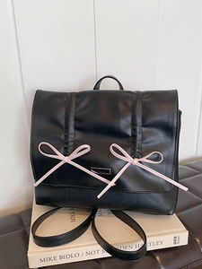 Chic black PU leather backpack with pink bow accents and pleated design for women
