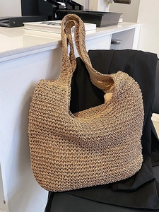 Fashionable woven straw tote bag in dark khaki for casual beach holidays and daily use