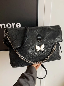 Black vintage crackle tote bag with 3D butterfly decor and silver chain strap