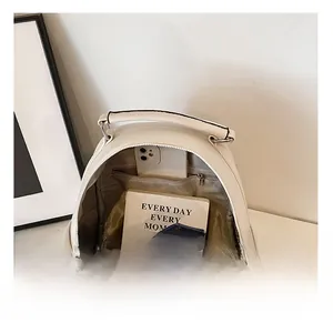 Internal view of beige backpack showing main compartment with zipper pocket and lining