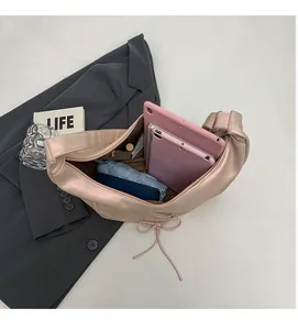 Top view of spacious interior of pink tote bag showing storage for tablet and umbrella