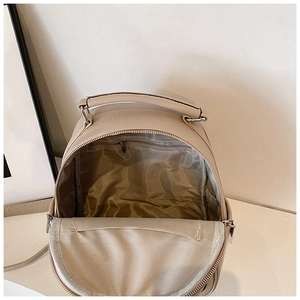 Close-up of beige leather backpack interior with herringbone lining and zipper pocket