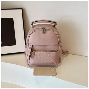 Detail view of pink leather backpack with diamond lattice stitching and size comparison