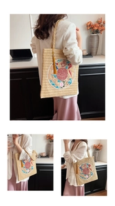 Detail of New Chinese straw tote bag with round dragon embroidery and yellow silk tassel