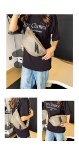 Detail showing the khaki canvas chest bag with CLEAR lettering and black woven zipper pull