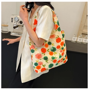 Detail of floral canvas tote bag with wide straps for daily commuting use