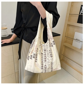 Detail of canvas tote bag featuring traditional Chinese calligraphy poetry print