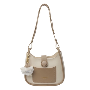 Fashionable contrast bucket bag in beige and brown leather with cute cat pendant