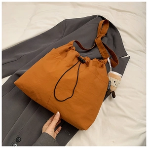 Orange-brown nylon tote bag with drawstring closure and cute coffee cup pendant