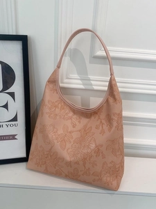 Chic apricot hobo shoulder bag with embossed floral texture and wide strap design