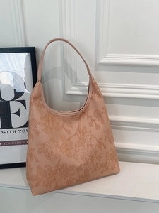 Pink tote bag with floral embossing and slim straps for casual stylish women's fashion