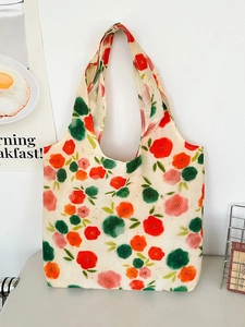 Minimalist cream canvas tote bag with vibrant floral pattern in a clean bright studio setting