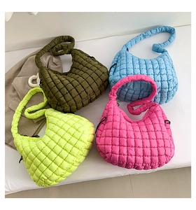 Detailed view of quilted puffer hobo bags in olive green, sky blue, lime, and rose pink