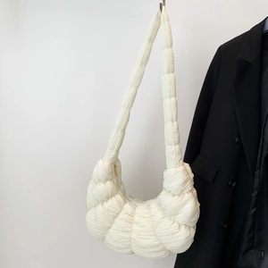 Chic beige pleated croissant bag with quilted design and wide shoulder strap