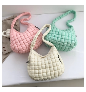 Three quilted cloud bags in pink mint green and beige shown on a white background