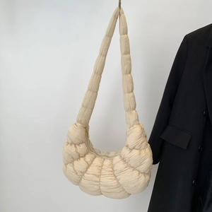 Chic beige pleated dumpling crossbody bag for women with minimalist soft texture