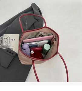 Top view of the spacious inner compartment of a tote bag with daily essentials inside