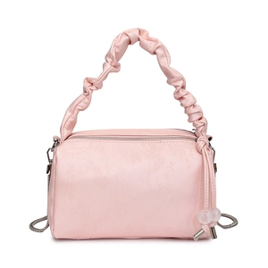 Pink pleated handle handbag with silver chain strap and beaded charm in a minimalist style