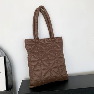 Quilted down tote bag in dark brown with geometric triangle stitching and top handles