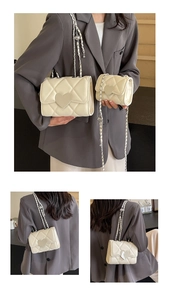 Detail of quilted chain bag with heart buckle and matching mini coin purse set