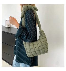 Olive green quilted puffer shoulder bag with a glossy finish and rhombus stitching details