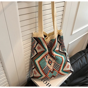 Detail of vibrant geometric jacquard knitting pattern on a bohemian tote bag