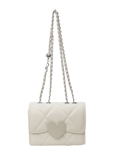 Quilted beige crossbody bag with a large heart buckle and silver chain strap