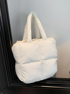 Quilted down cotton puffer tote bag in white with spacious padded shoulder straps