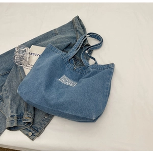 Classic blue denim tote bag with white embroidery and top metal snap closure for women