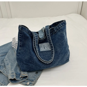 Blue washed denim tote bag with 7STREET patch embroidery on a stylish casual shoulder bag