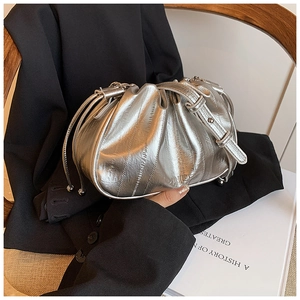 Detailed shot of silver metallic ruched cloud bag with fine drawstring design and logo