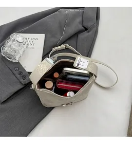 Top view of cream white bucket bag interior showing large capacity for essentials