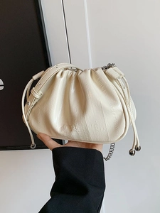 Chic pleated cloud bag in creamy white with a silver chain and drawstring details