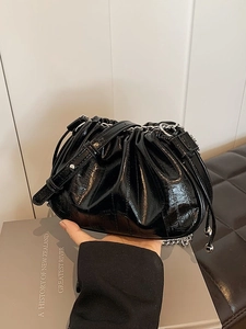 Chic black pleated cloud bag with glossy finish and silver chain strap for women