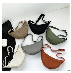 Corduroy dumpling bags in multiple colors with textured stripes and adjustable straps