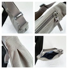 Detailed close-up of grey corduroy handbag features, including zipper and adjustable strap