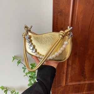 Metallic gold crescent hobo bag with large pearl strap and silver heart charms
