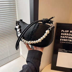Chic black crescent underarm bag with pearl chain and silver heart charm