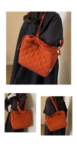 Détail du sac cabas matelassé orange avec surpiqûres en losange et fermeture à cordon