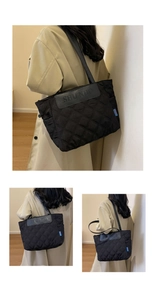 Detail of quilted tote bag with leather logo patch and elegant rhombic stitching texture