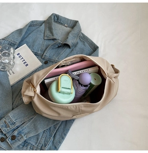 Macro view of beige tote bag interior showing spacious storage for daily essentials