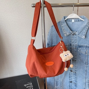 Burnt orange large capacity nylon tote bag with iFashion label and plush charm
