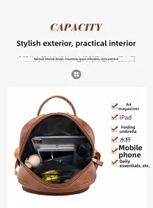 Internal view of brown litchi pattern leather backpack showing large storage capacity