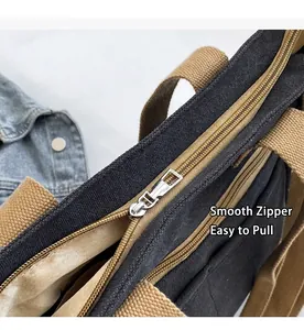 Détail du zip en métal argenté fluide sur un grand sac cabas en toile robuste