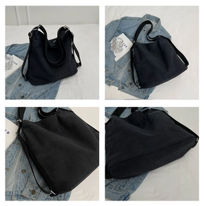 Multi-angle details of the large black canvas tote bag with wide straps and silver hardware